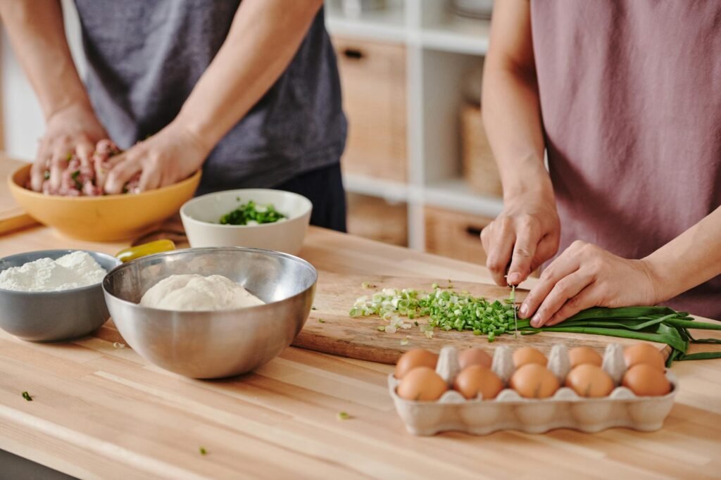 Potatoes, eggs, and onion next to a grocery receipt on a kitchen counter