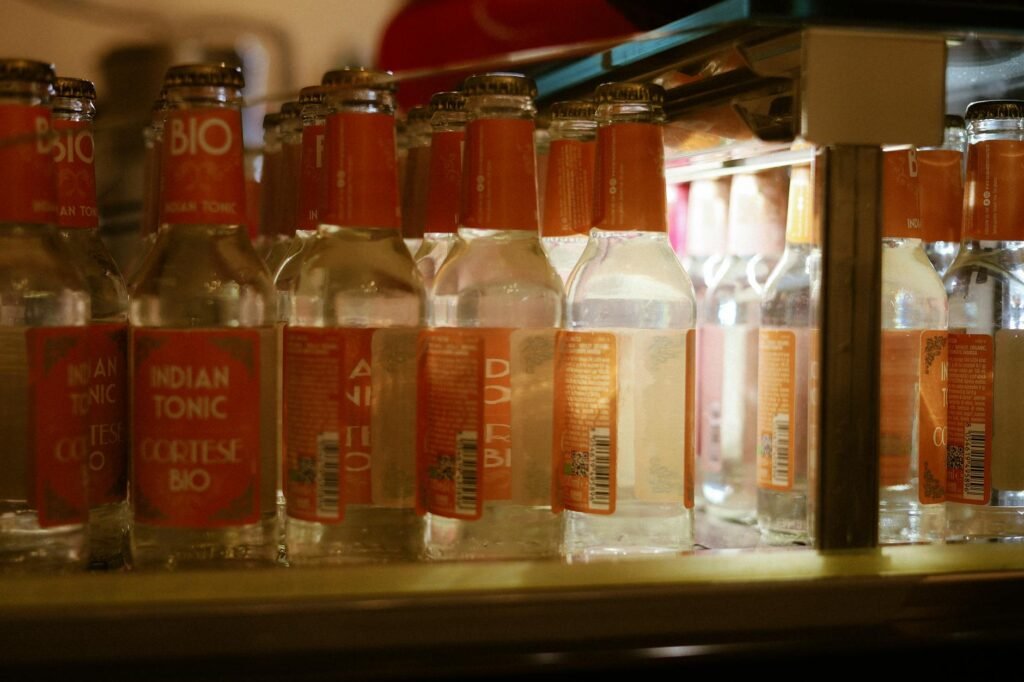 Labeled leftover containers arranged neatly on a refrigerator shelf.